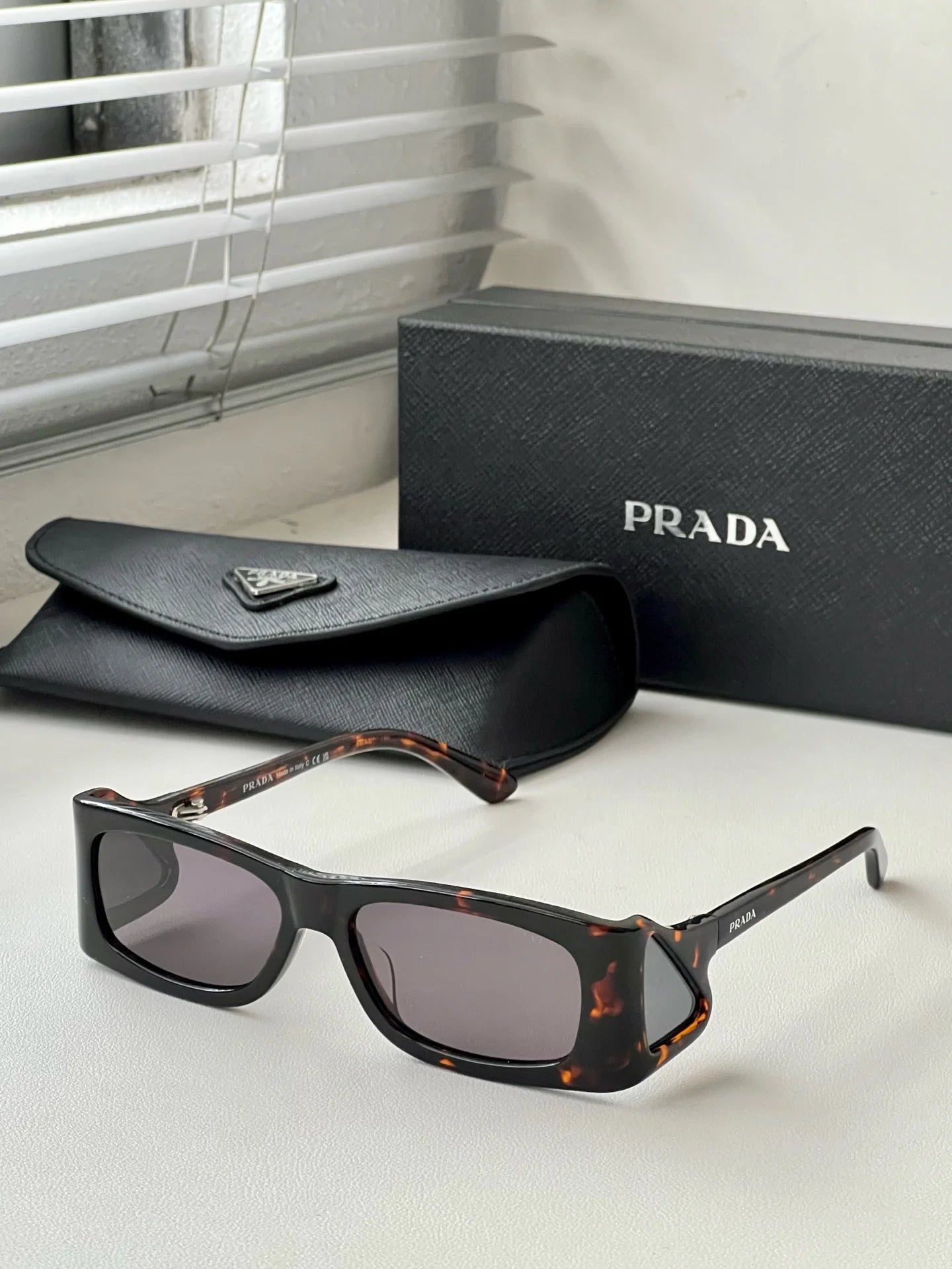 PRADA SUNGLASSES